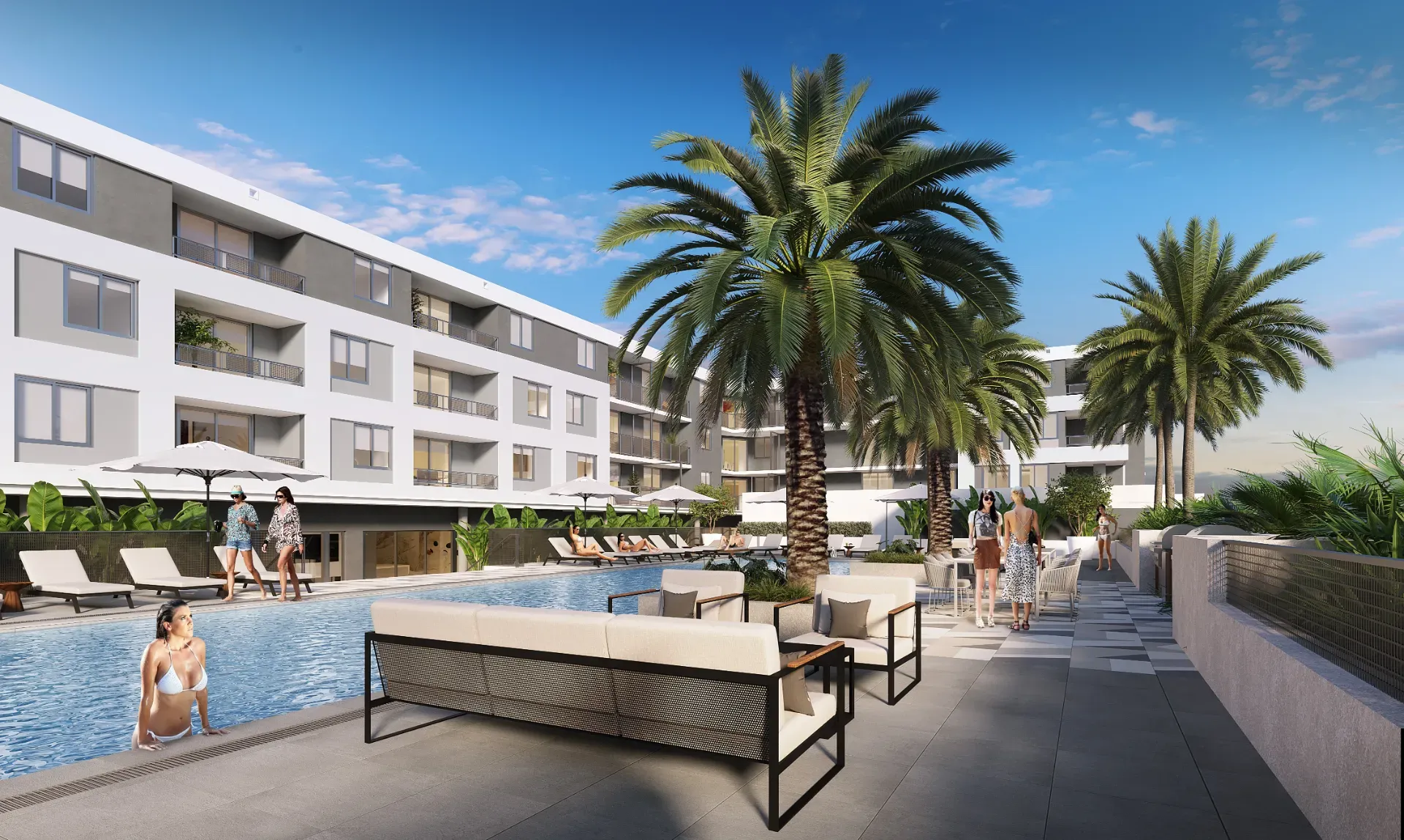 A resort-style pool with contemporary outdoor furniture and tropical palm trees
